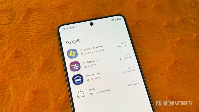 Samsung-phone-on-an-orange-pillow-showing-a-list-of-apps-scaled-1