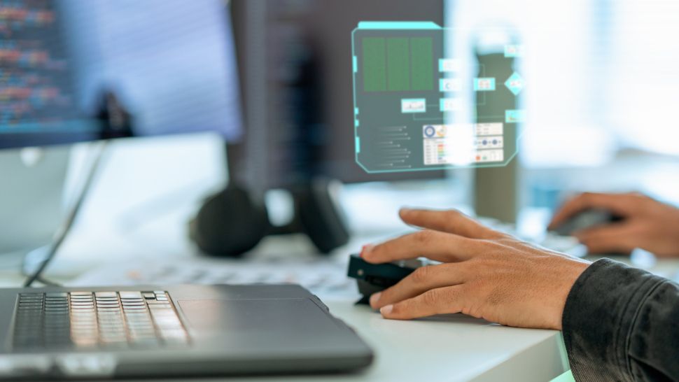 Close up shot hand of Software developers using computer to write code sitting at desk with multiple screens with digitization display working at office. Programmer and coding development concept.