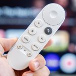 Chromecast-with-Google-TV-remote-on-hand-stock-photo-1