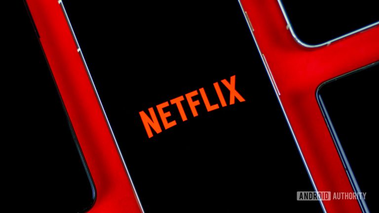 Netflix-logo-on-smartphone-next-to-other-devices-stock-photo-2