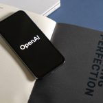 Open-AI-ChatGPT-logo-on-phone-stock-photo-1